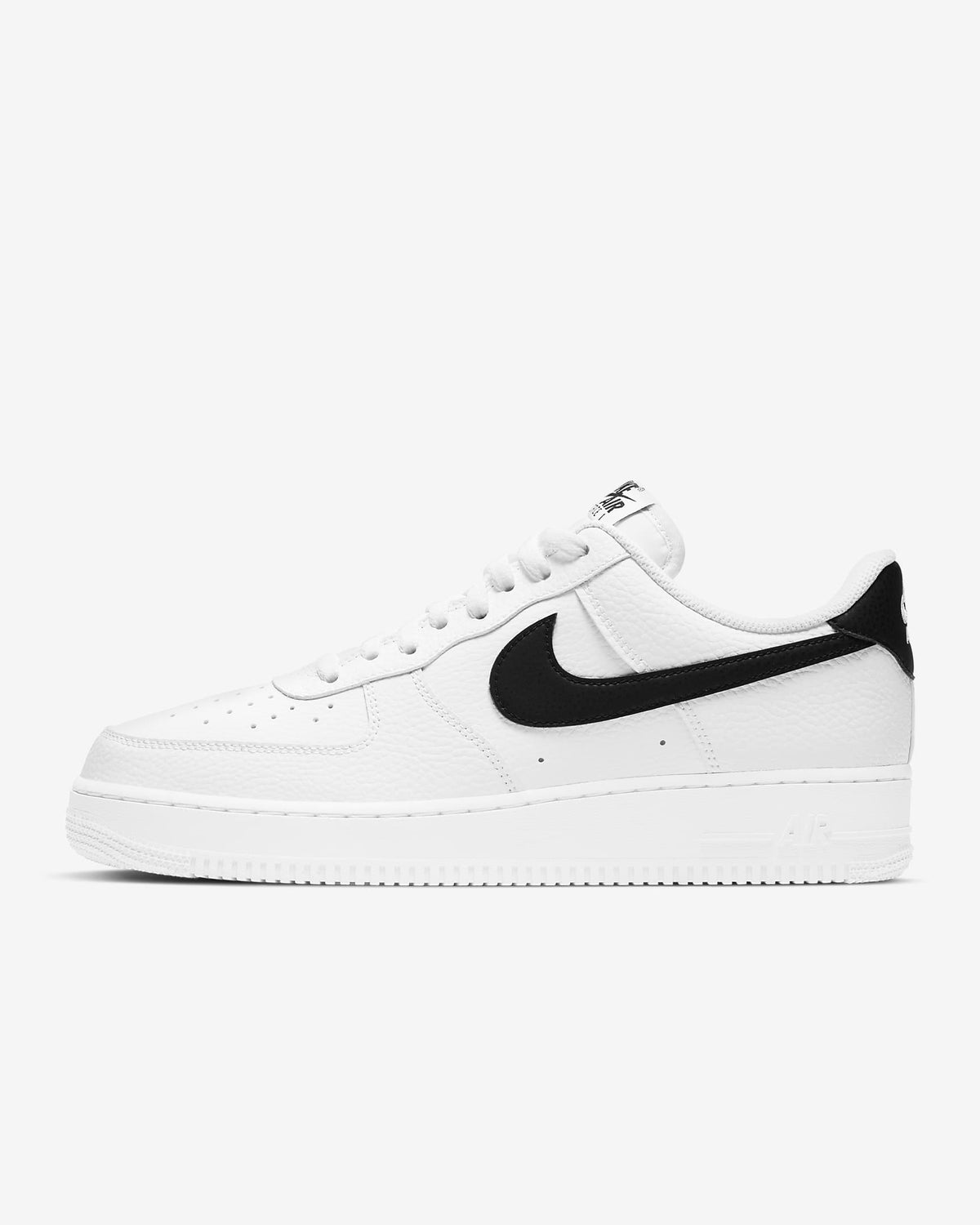White leather low-top sneaker with black Nike swoosh and white laces