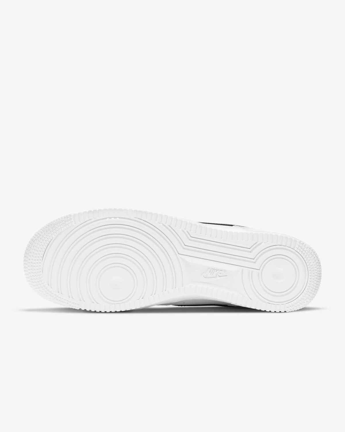 White rubber outsole with circular tread pattern on Air-style sneaker
