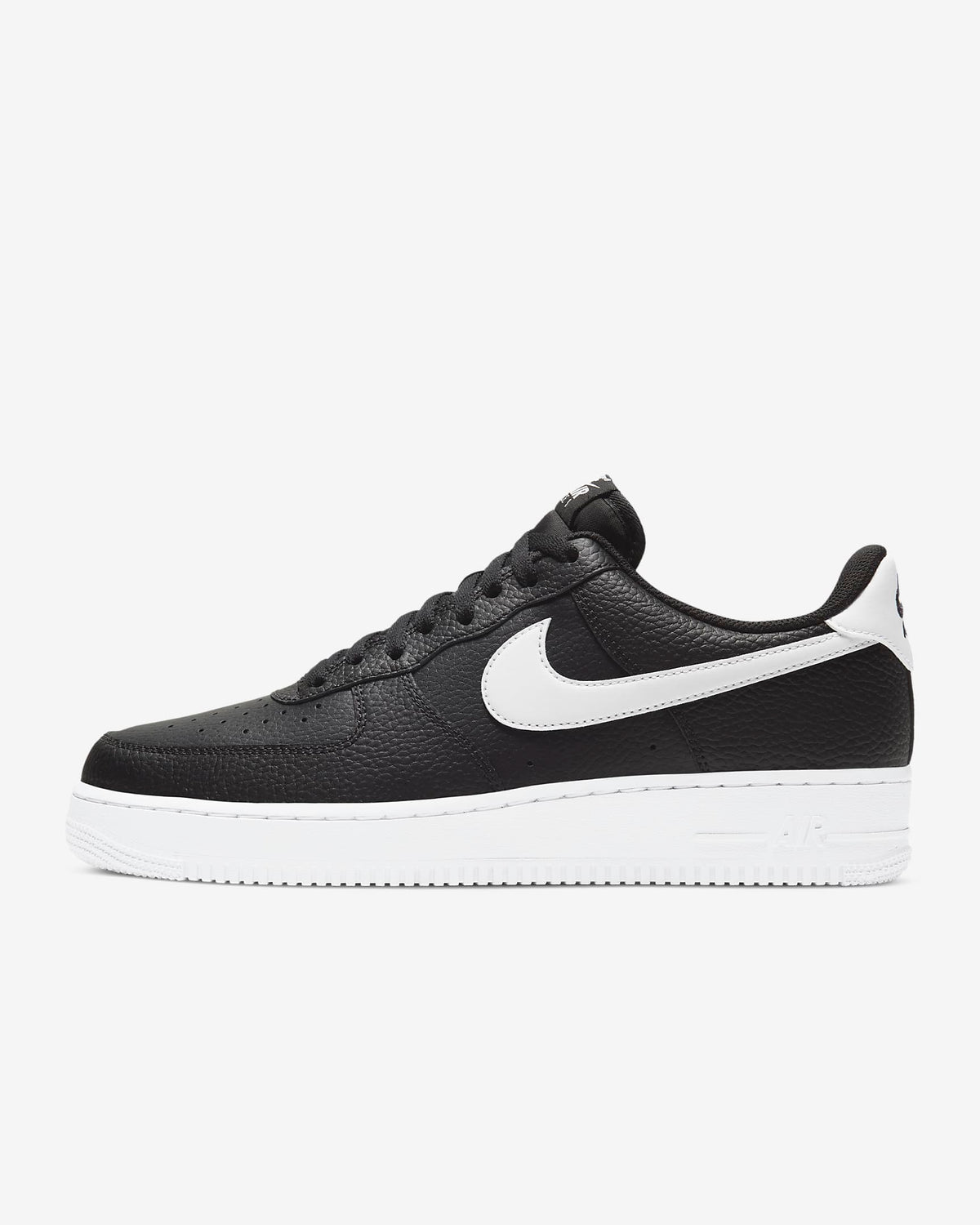 Black leather low-top sneaker with white swoosh and white midsole