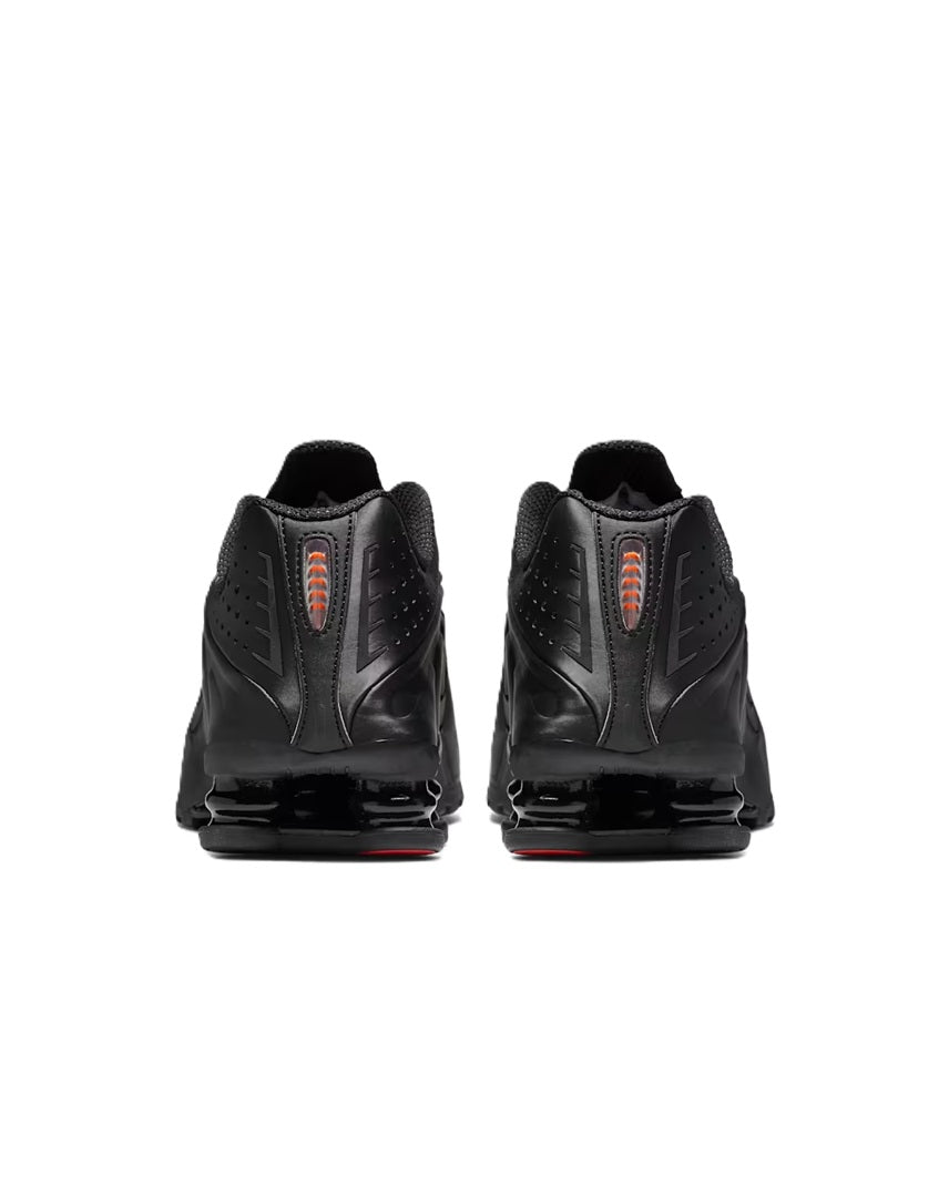 Women's black running shoe heel view with lace-up and padded collar