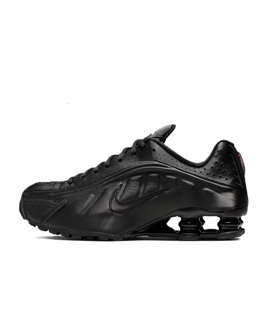 Nike Shox R4 women's black running shoe with perforated upper and lace-up