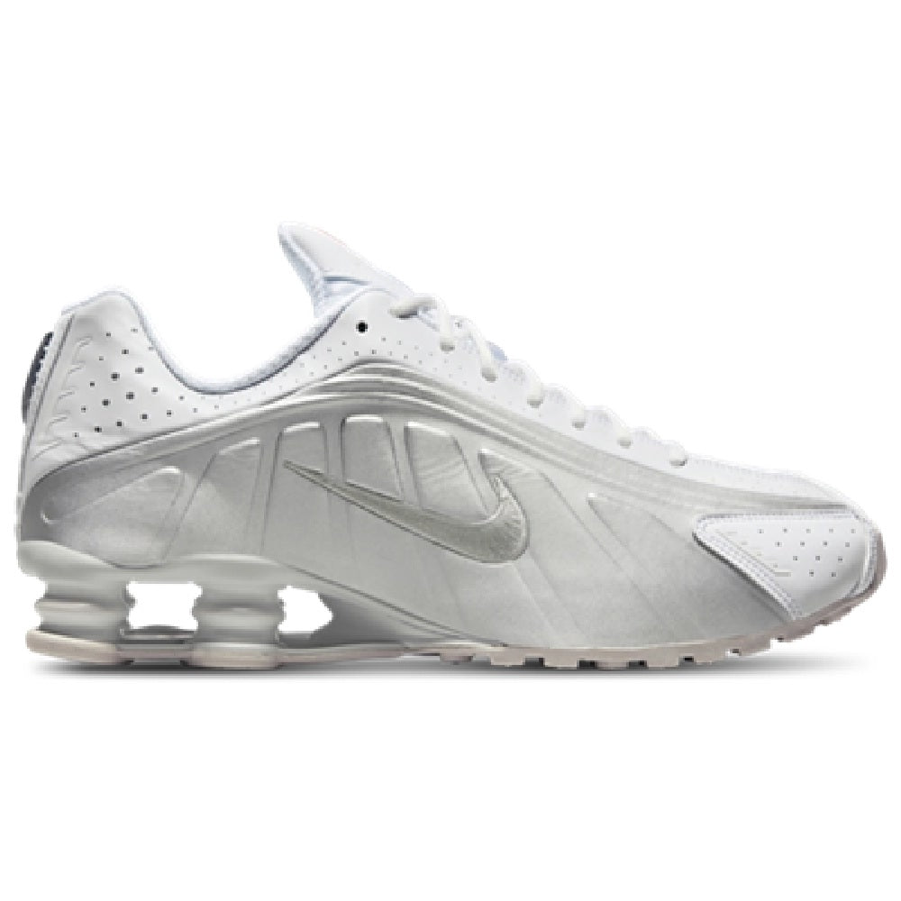 Women's Nike SHOX R4 sneakers in white with metallic silver Swoosh and visible cushioning