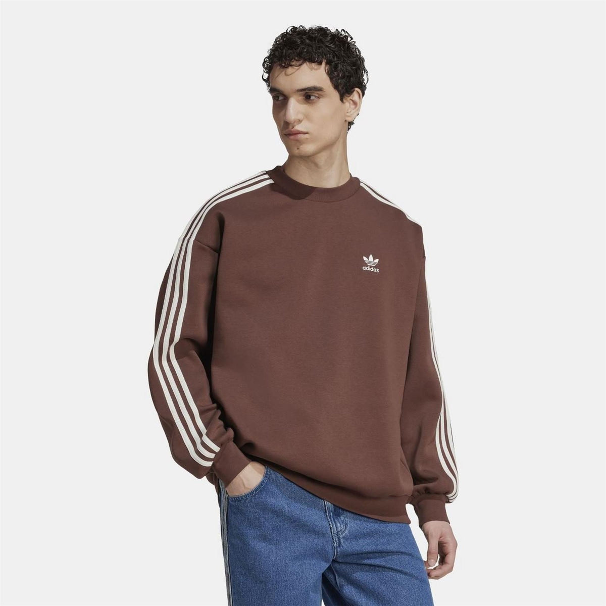 Brown crewneck sweatshirt with adidas logo and white stripe detailing on sleeves