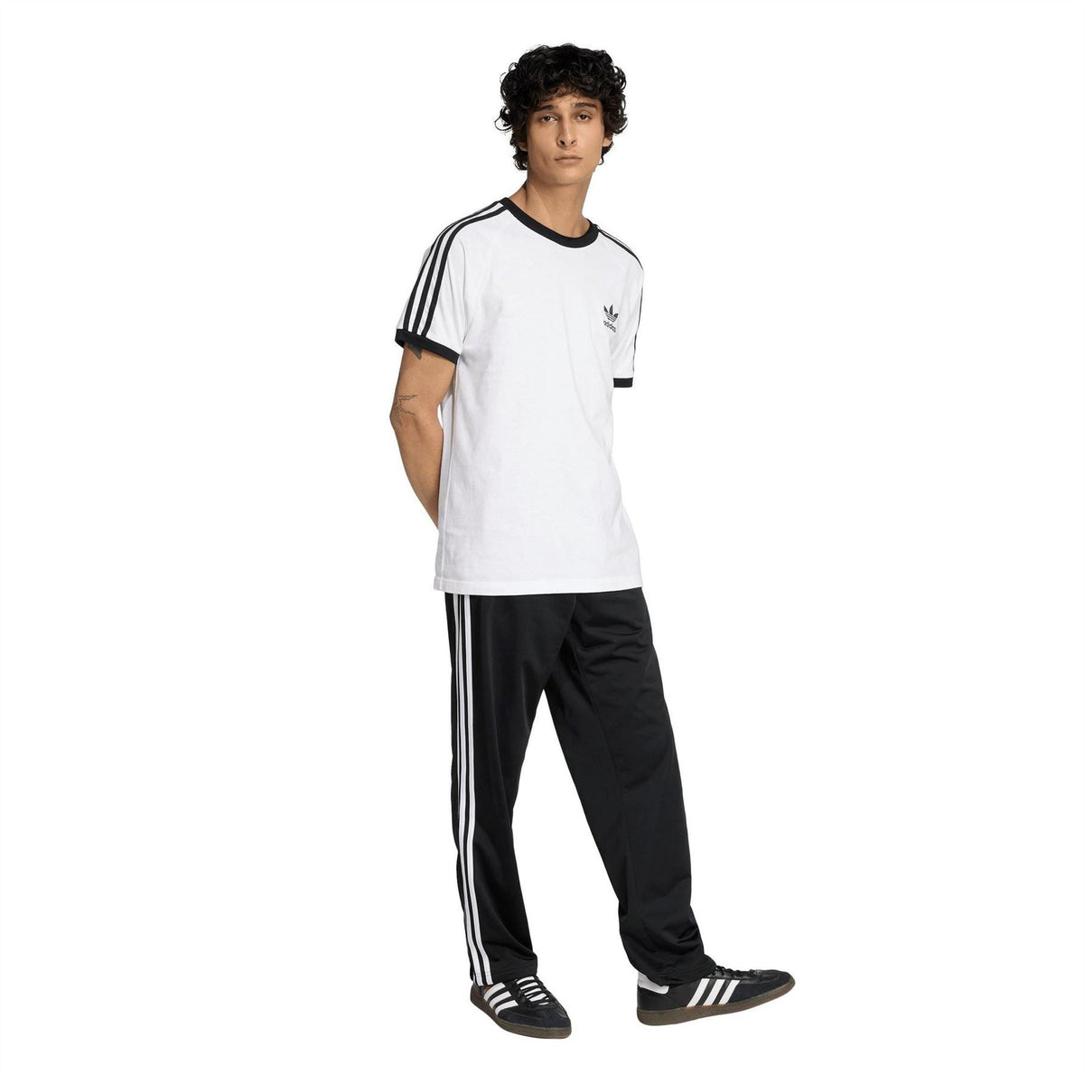 adidas men's black track joggers with three white stripes down the legs and trefoil logo