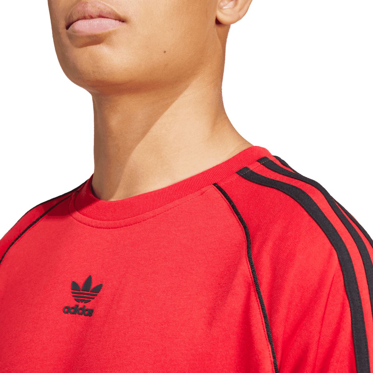 Red adidas SST T-shirt neckline close-up with adidas logo and black trim stripes