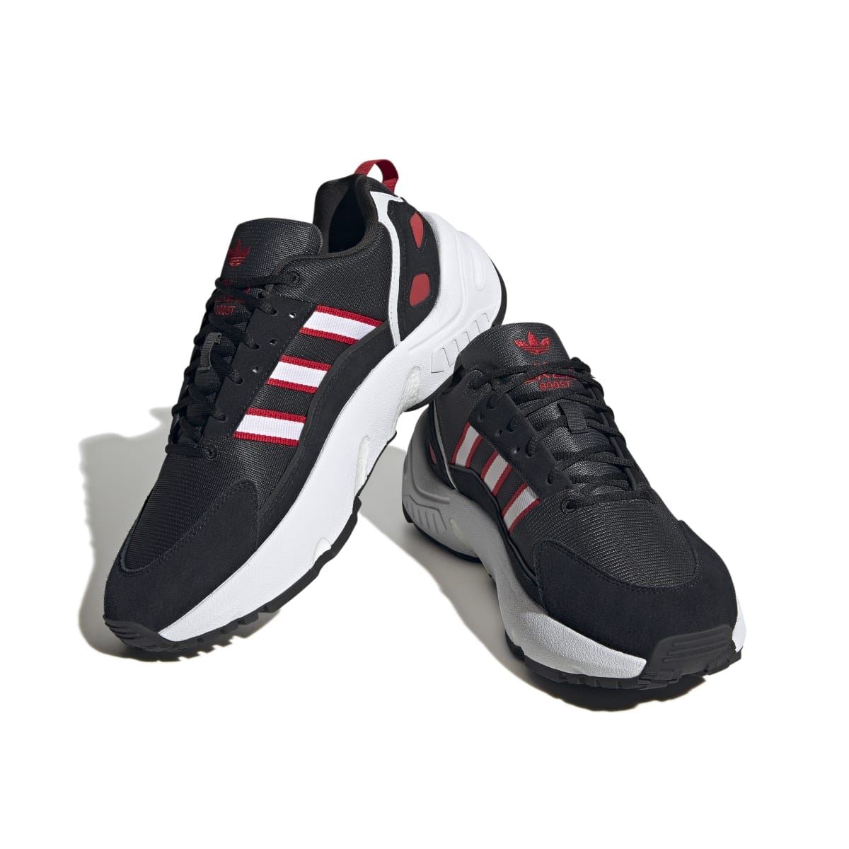 ZX 22 Boost trainers in black with red and white stripes, shown from side angle