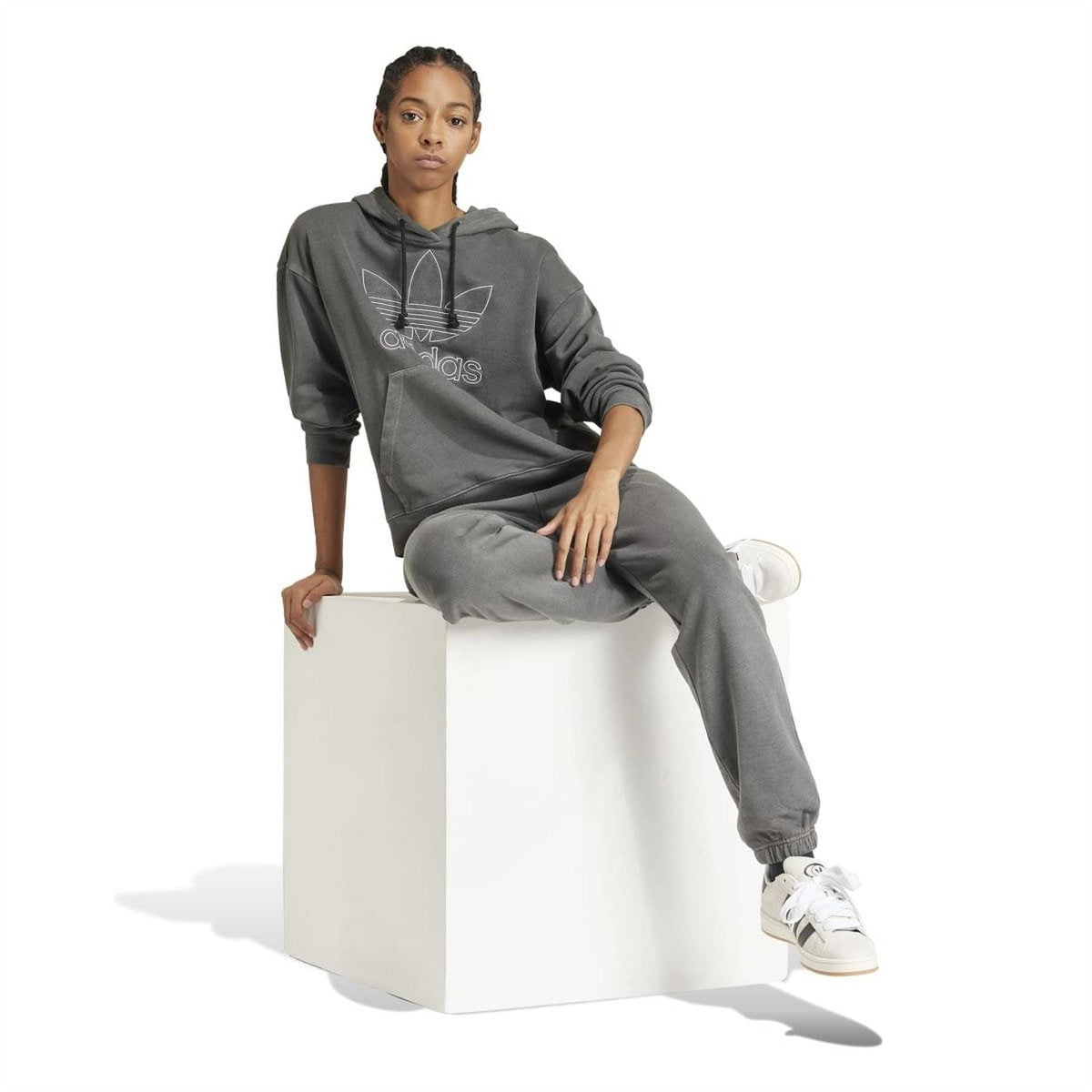 Charcoal hoodie worn with jogger pants; drawstring hood and adidas chest logo