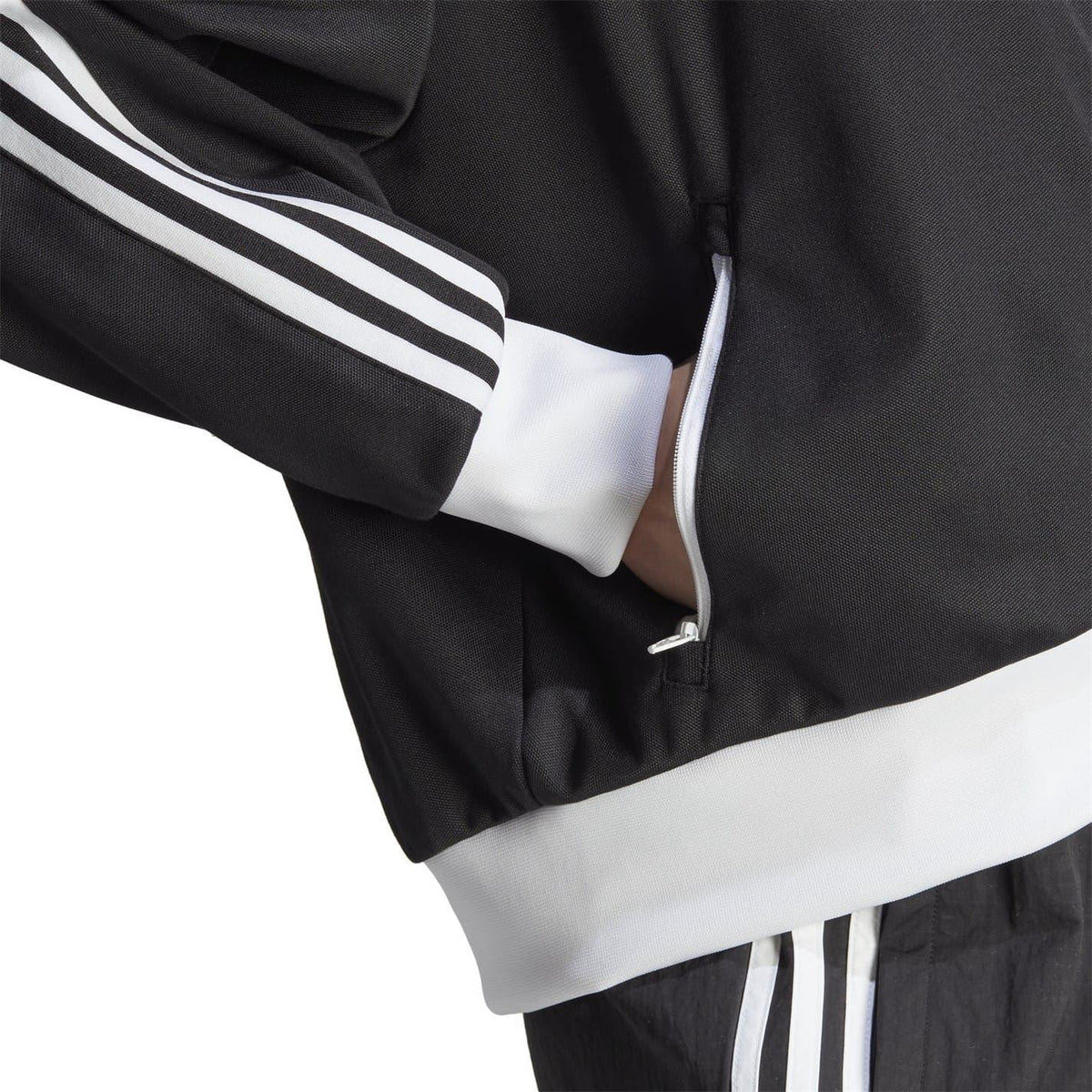 adidas Originals high-neck ribbed cuff sweatshirt in black, featuring a textured fabric and sporty design detail.