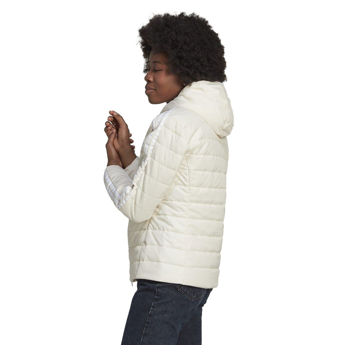 Light cream hooded puffer jacket, angled back/side view, quilted insulation.