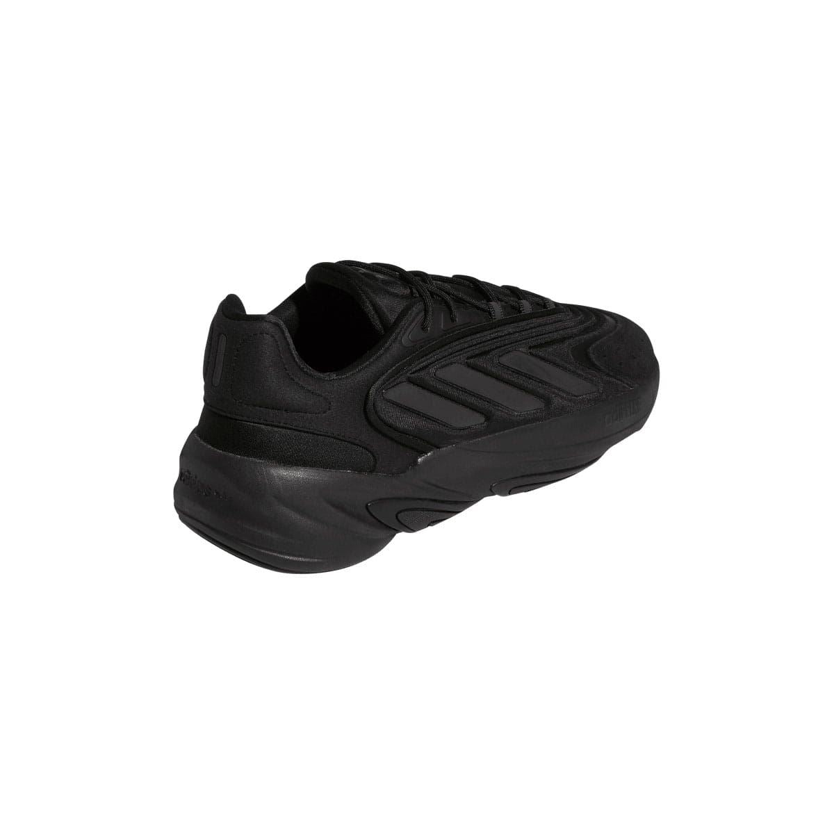 Black trainers heel view with cushioned collar and sculpted back panel