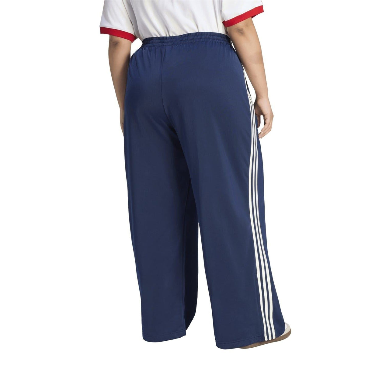 Loose track pants in dark navy with white triple side stripes and elastic waist