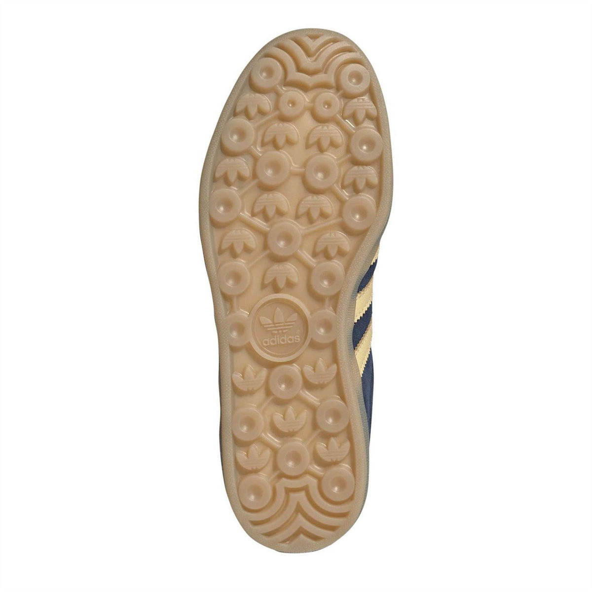 Gum rubber outsole with textured tread on navy adidas Gazelle sneakers