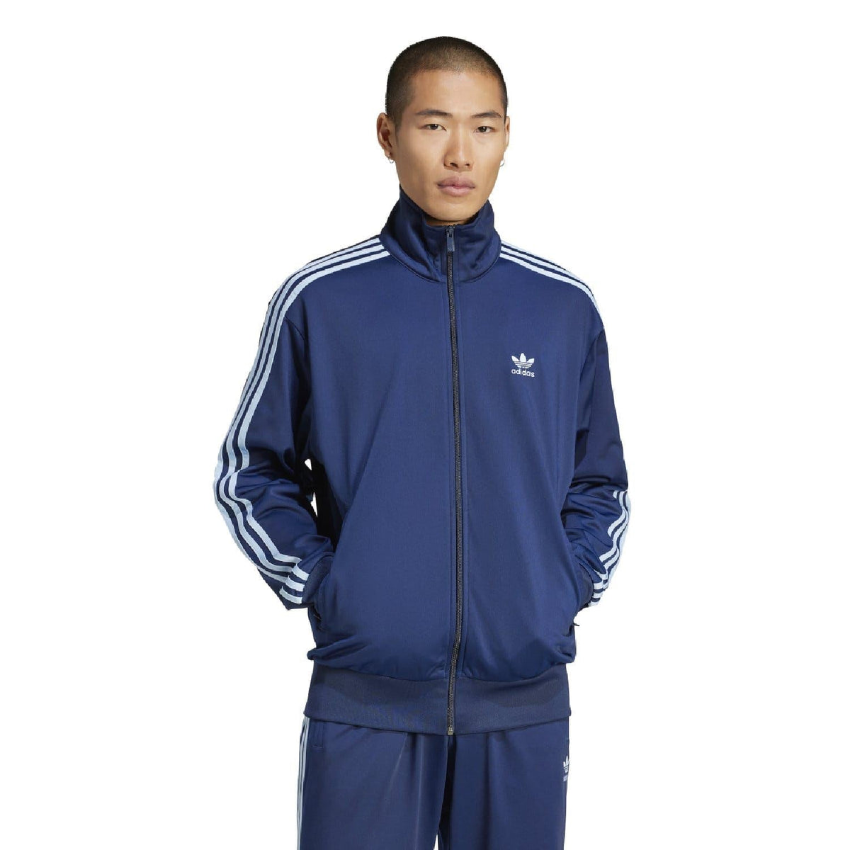 Indigo adidas Originals track jacket with full-zip, stand collar, and white triple stripes