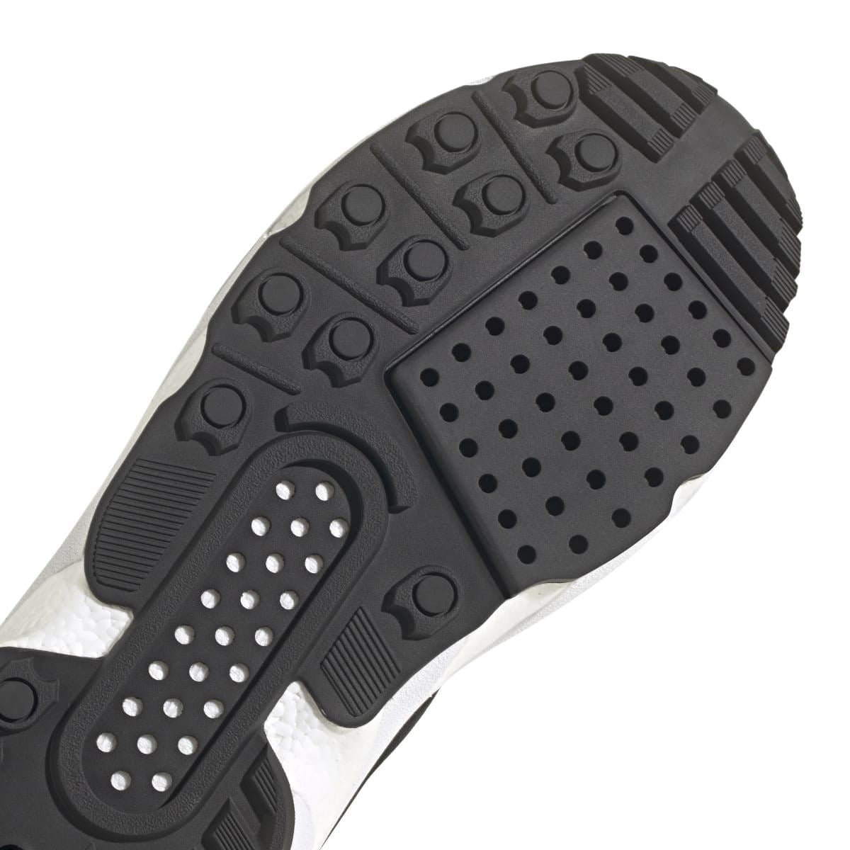 Close-up of black and white ZX 22 Boost outsole with traction dots and tread pattern