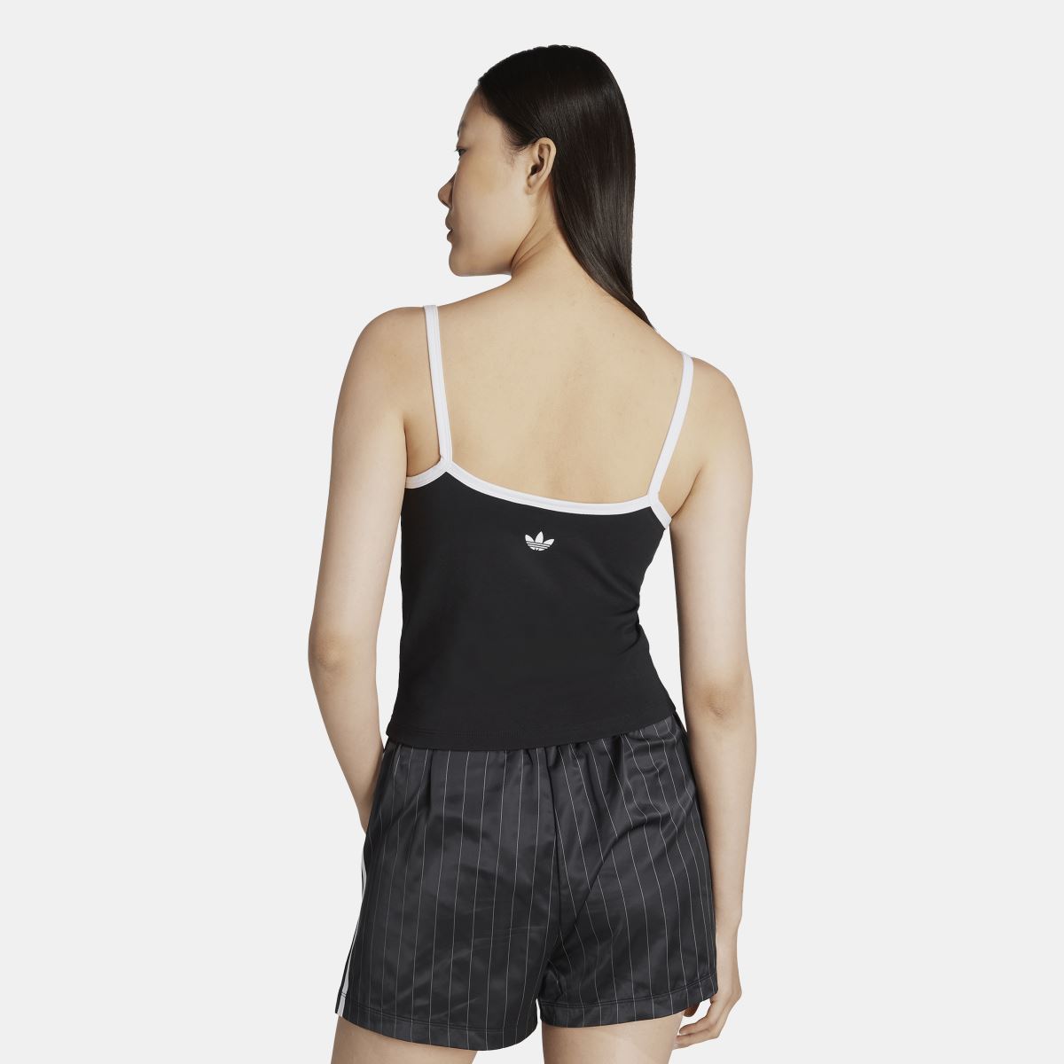 Black adidas tank top back, thin straps and small white adidas trefoil near hem