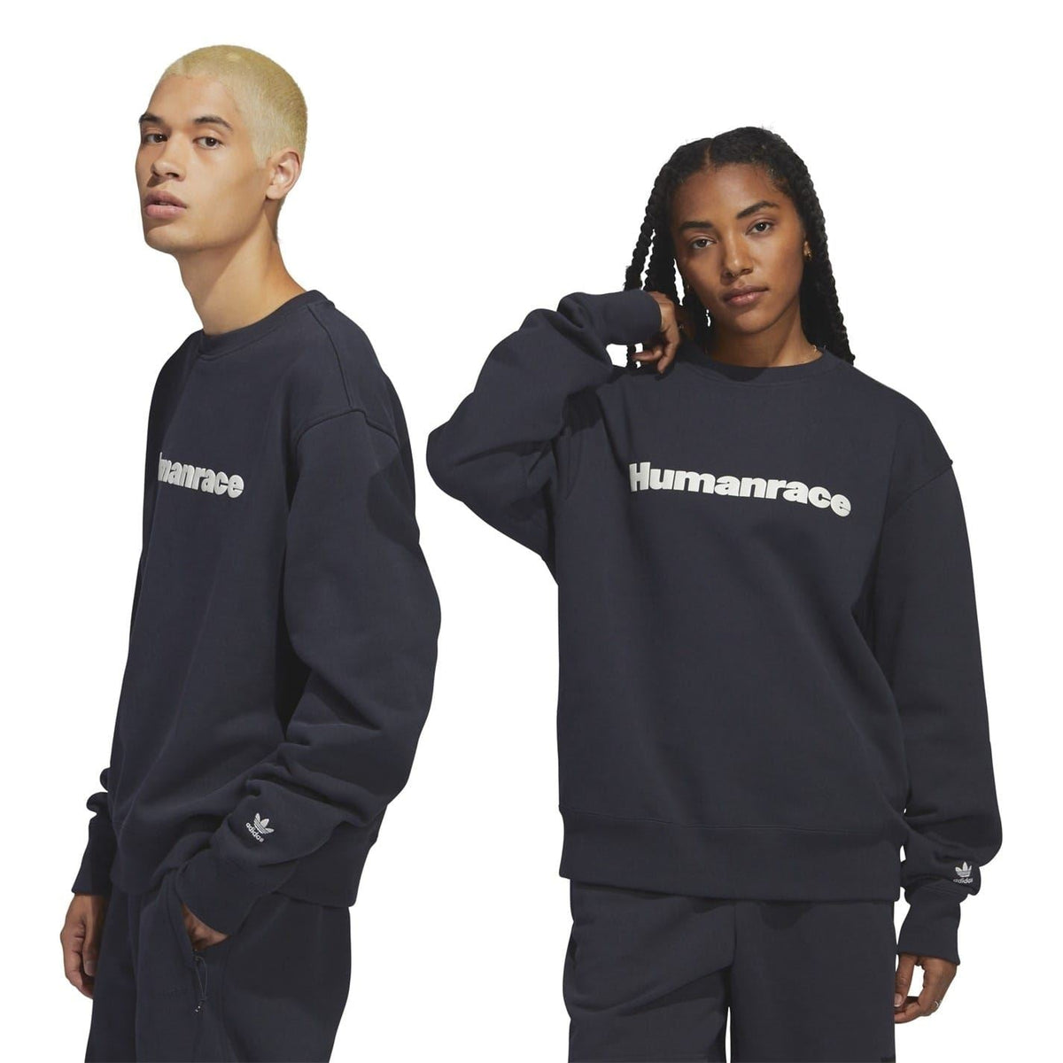 Dark navy relaxed-fit crewneck sweatshirt with “Humanrace” chest logo, ribbed cuffs.