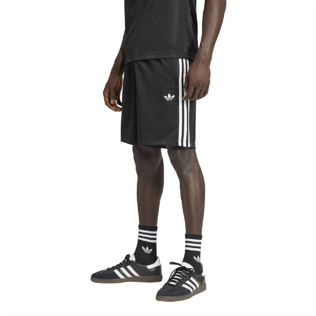 Black loose shorts with white vertical 3-stripe panels and small adidas trefoil logo