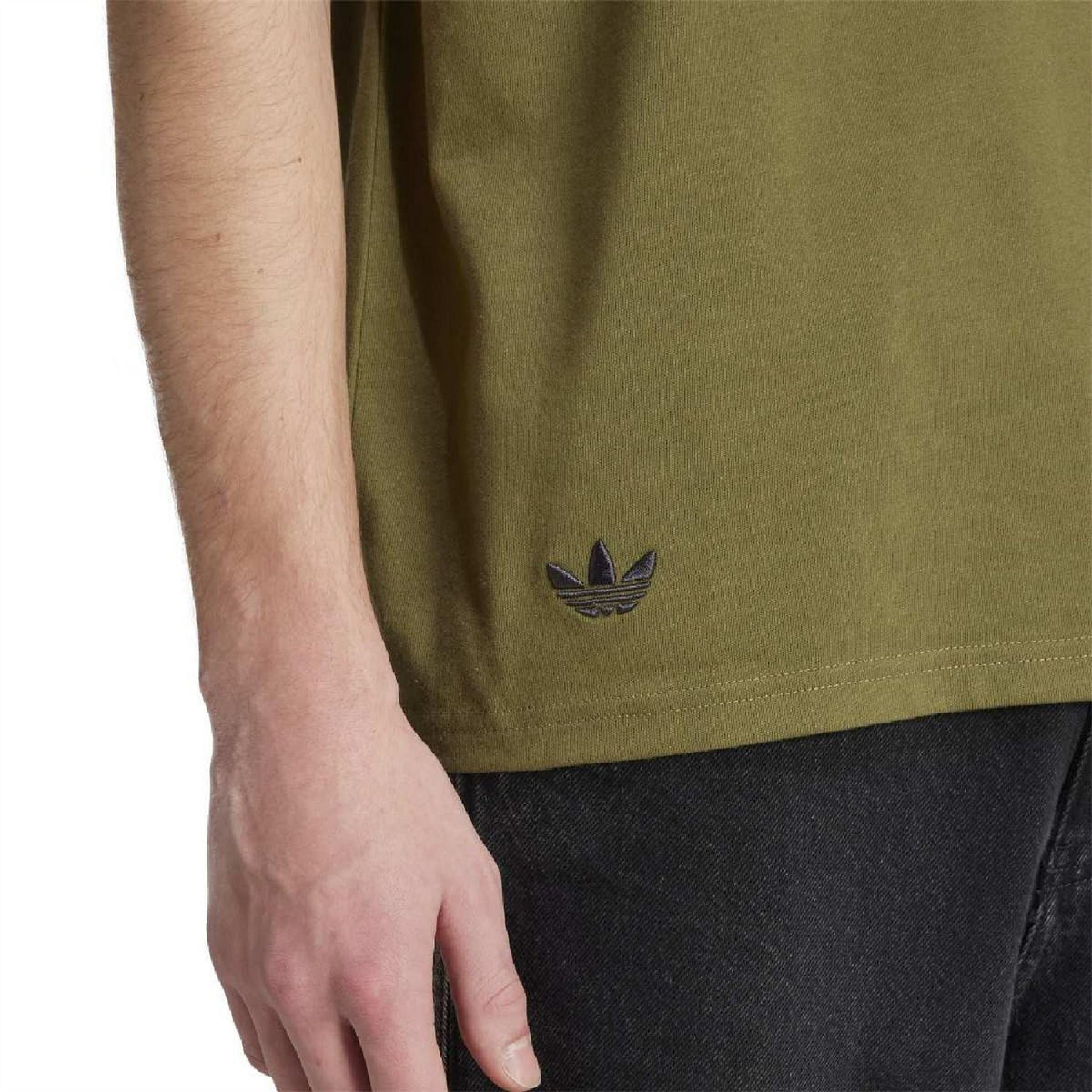Focus olive T-shirt close-up with adidas trefoil at hem