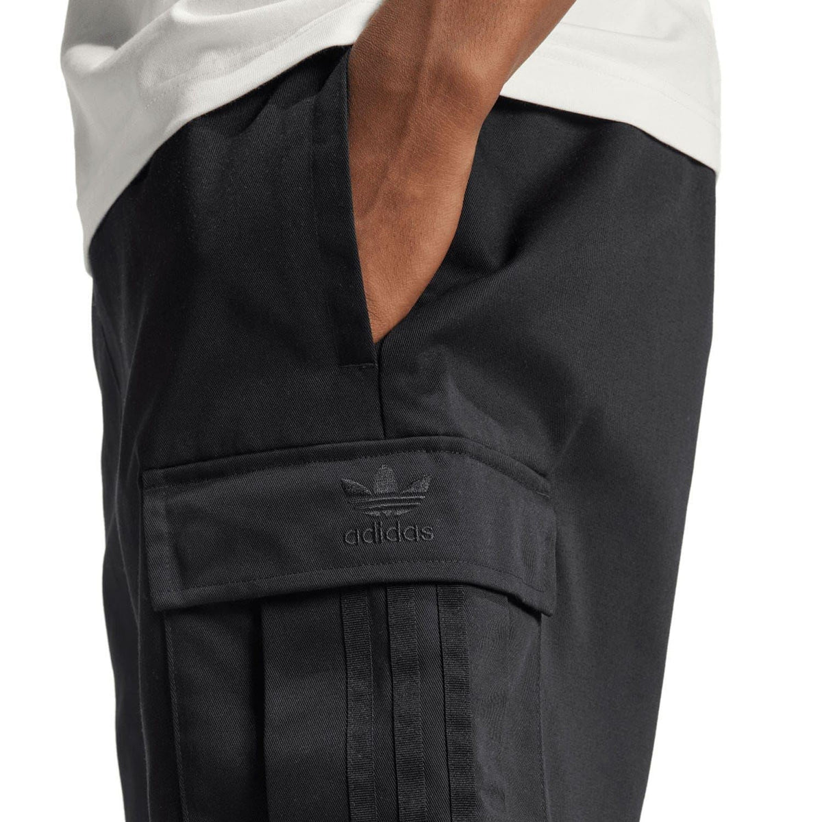 Black cargo shorts with adidas logo patch and flap utility pocket