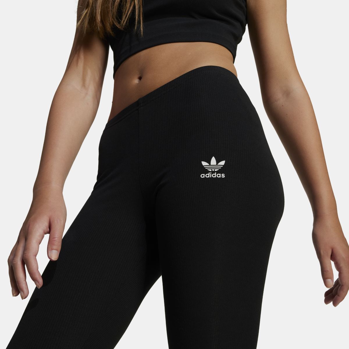 Black ribbed juniors leggings with adidas trefoil logo at hip
