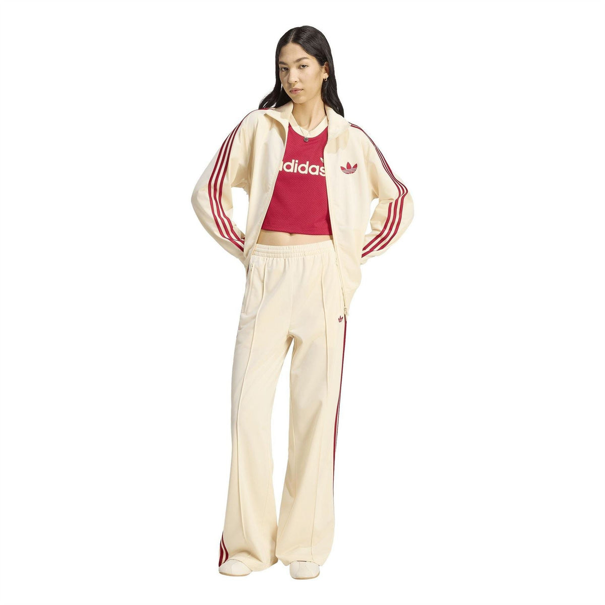 Cream adidas trefoil jogger pants with red track stripes, wide leg