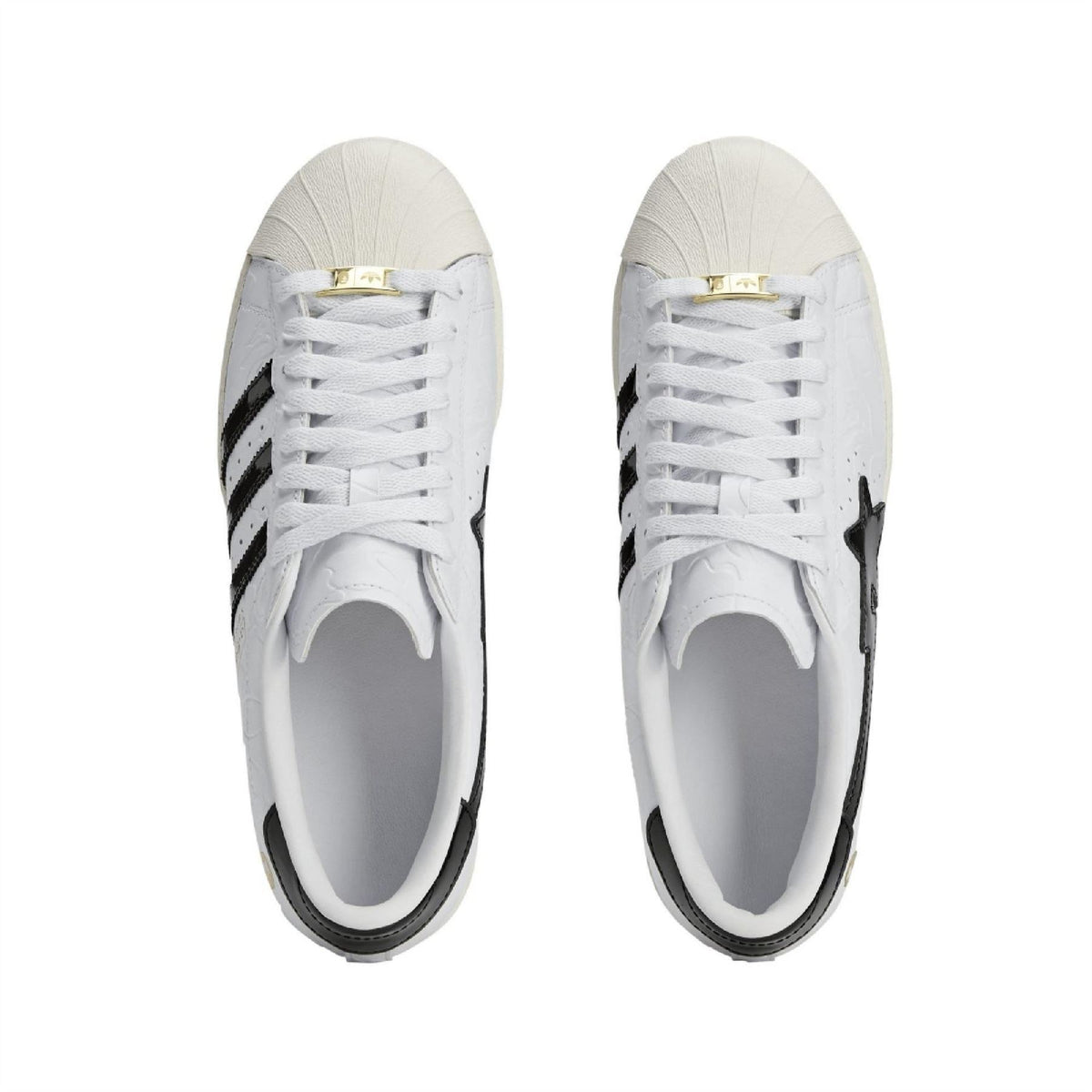 White Adidas Originals SSTR sneakers, front view with white laces and tongue label