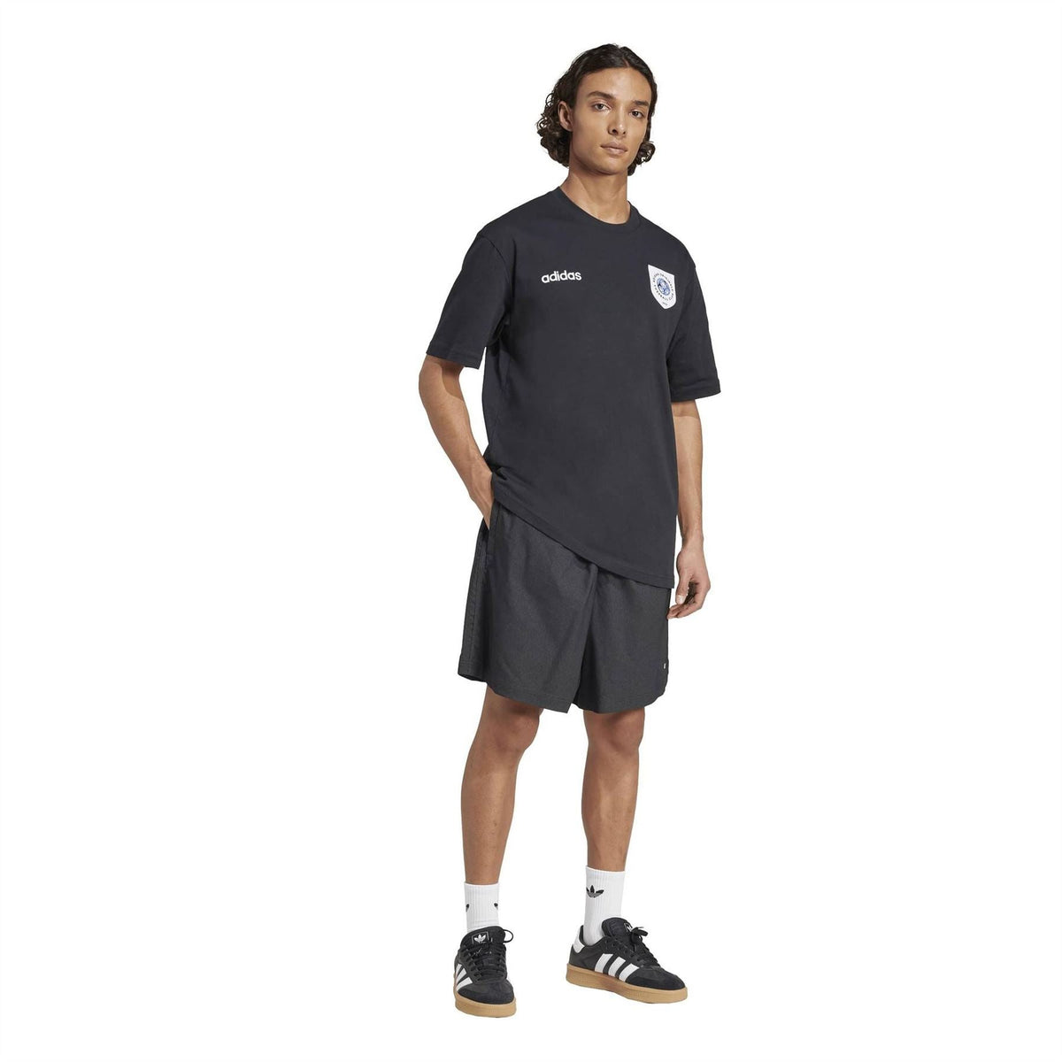 Black crew neck adidas jersey T-shirt worn with matching dark shorts