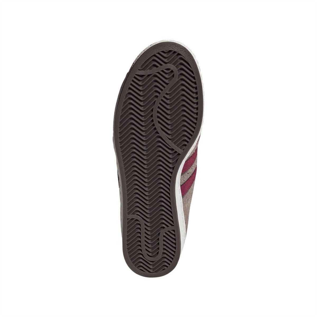 Brown sneaker outsole with textured tread and visible side stripe trim