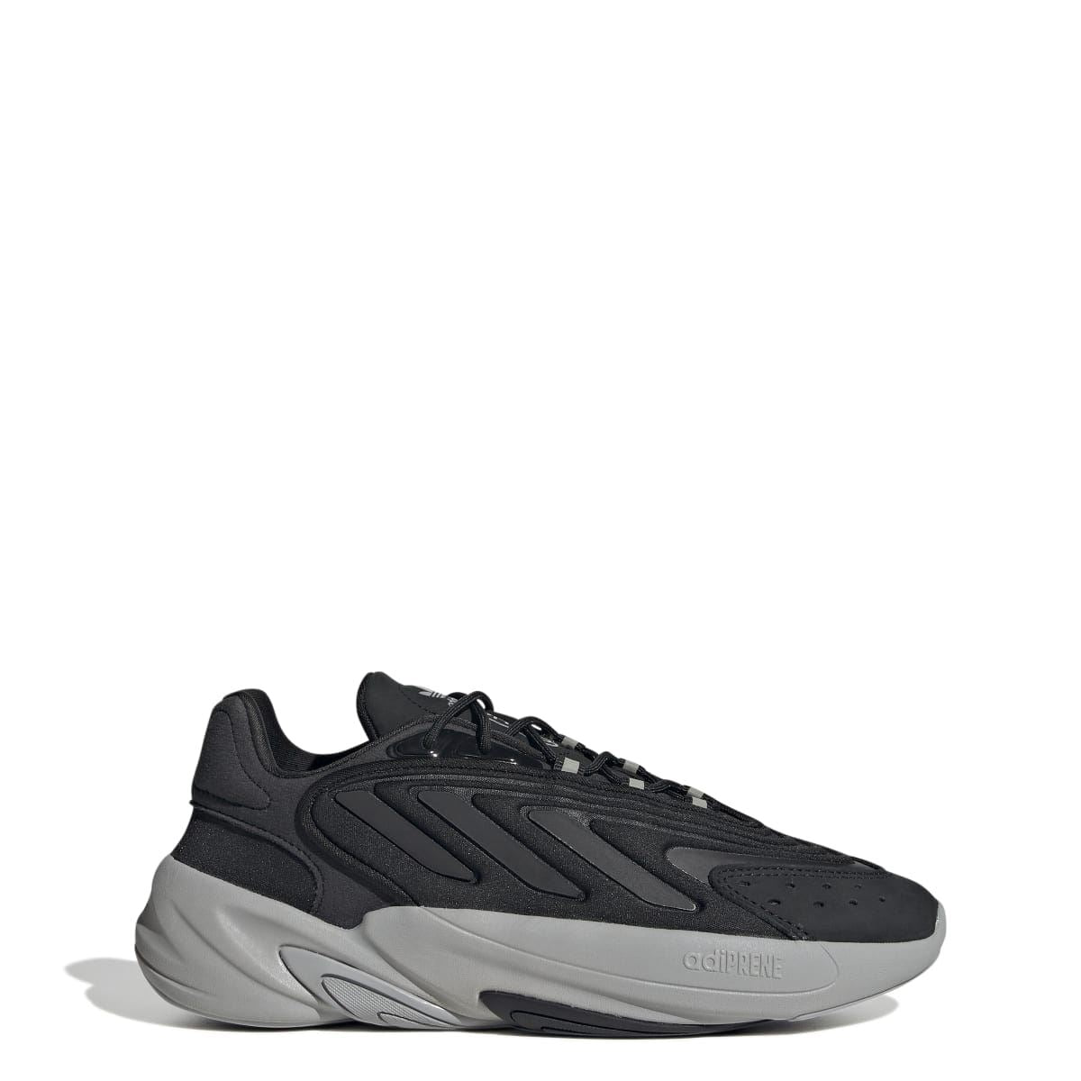 Black lace-up trainers with molded panels and light-gray chunky sole, adidas logo