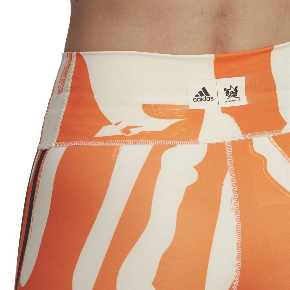 adidas Originals graphic biking shorts in orange and beige abstract print