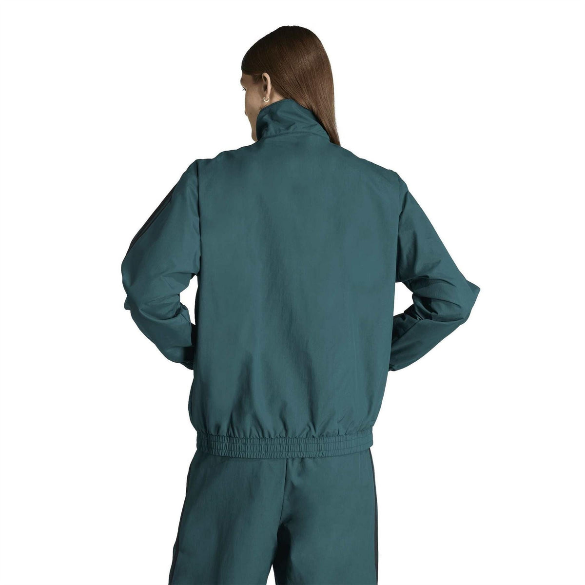 Women’s adidas teal woven track top from back view with ribbed waistband and cuffs