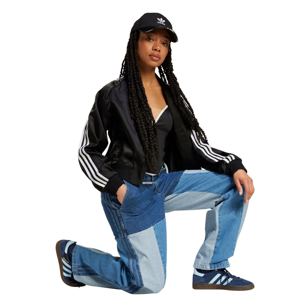 Patchwork straight-leg blue jeans with contrast denim panels and drawstring waistband.