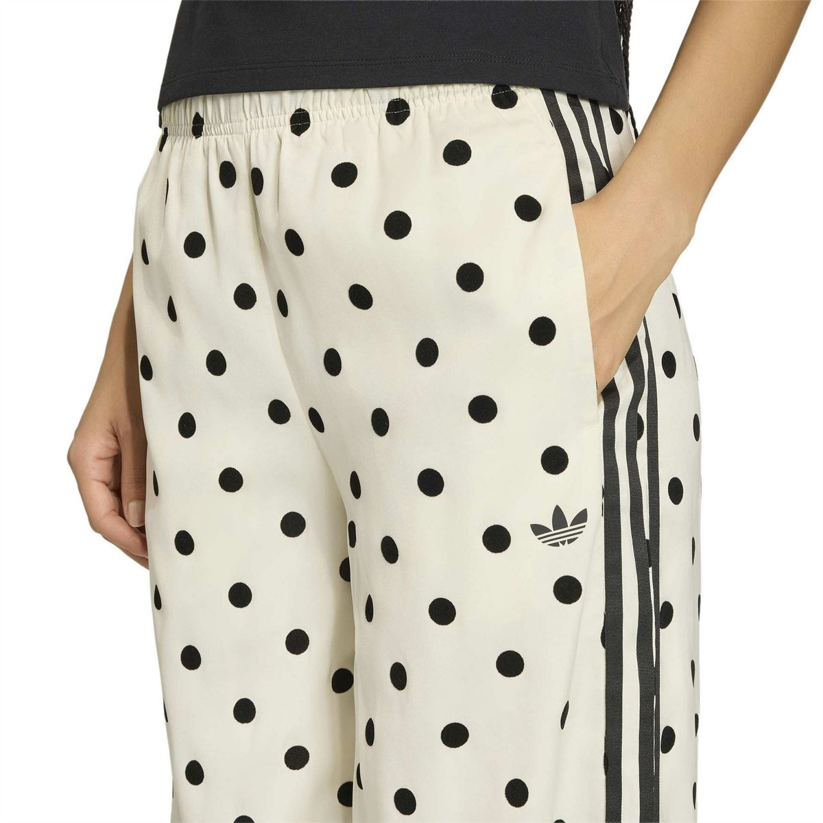 Off-white elastic-waist wide-leg pants with black polka dots and side stripe detailing