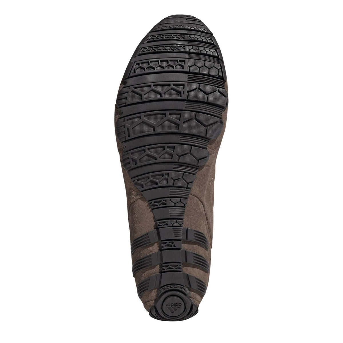 Brown shoe outsole with thick tread pattern and rugged rubber grip