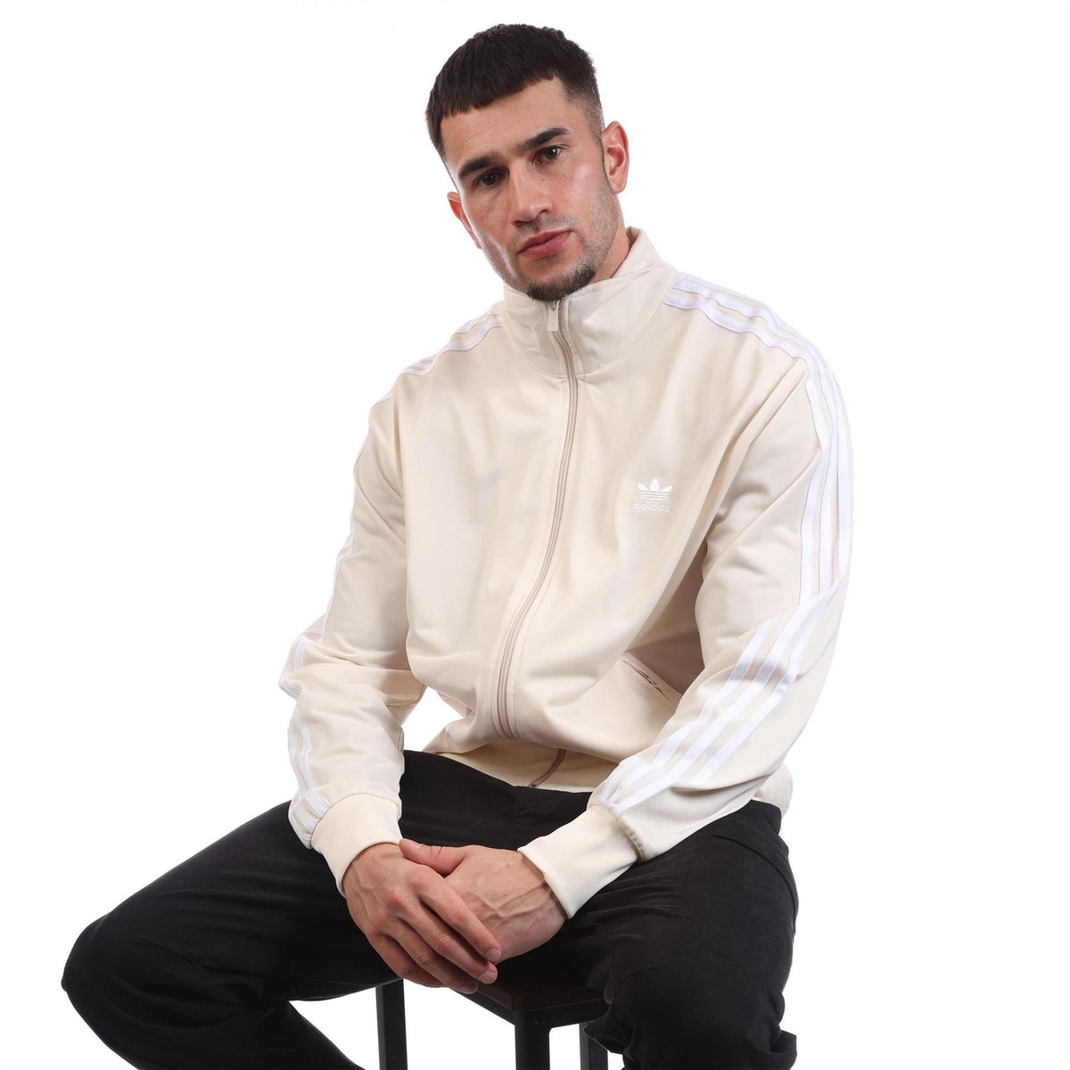adidas Originals Classics Firebird Track Top in black with white stripes, front view showing collar and zip closure