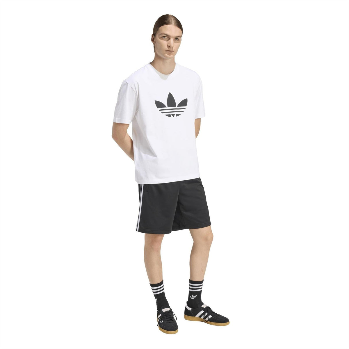 Black adidas shorts with white side stripes, elastic waistband and relaxed knee length