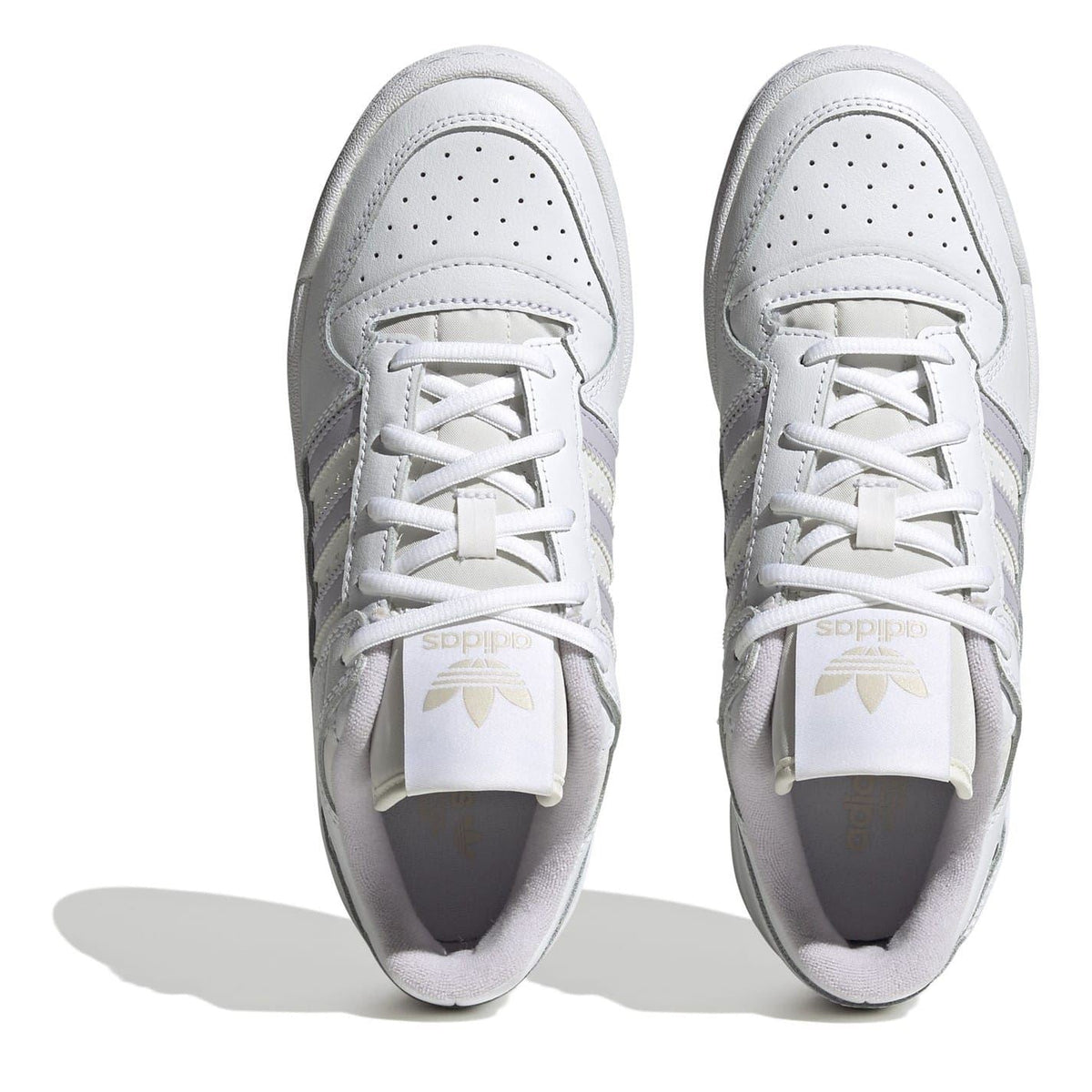 White low-top sneakers with lace-up front and perforated toe panel