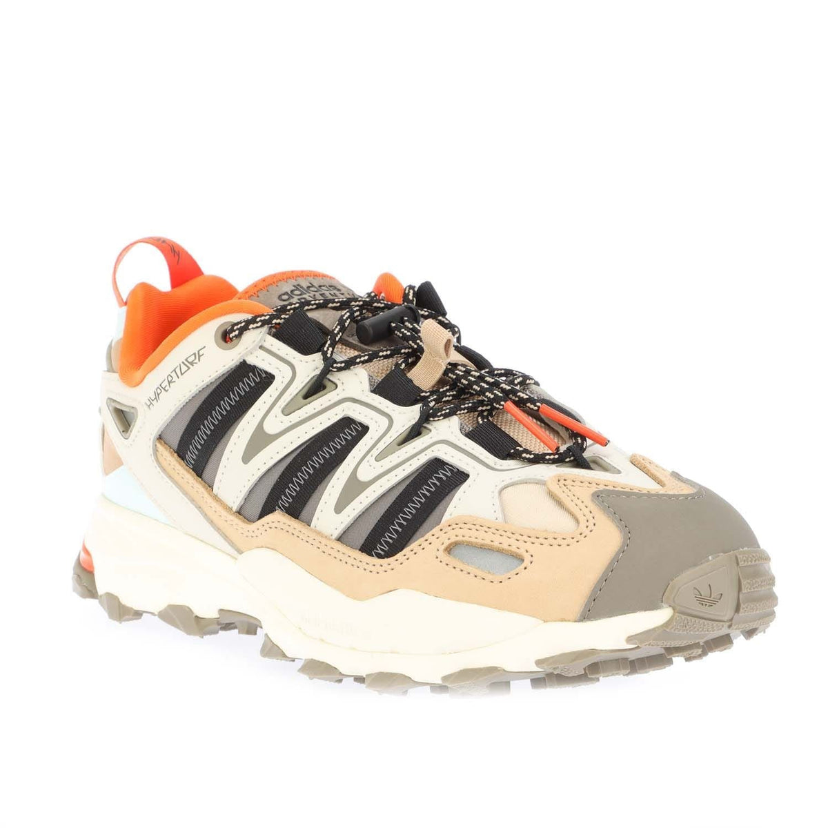 Grey, cream, and orange low-top trainers with black mesh panels and chunky tread sole