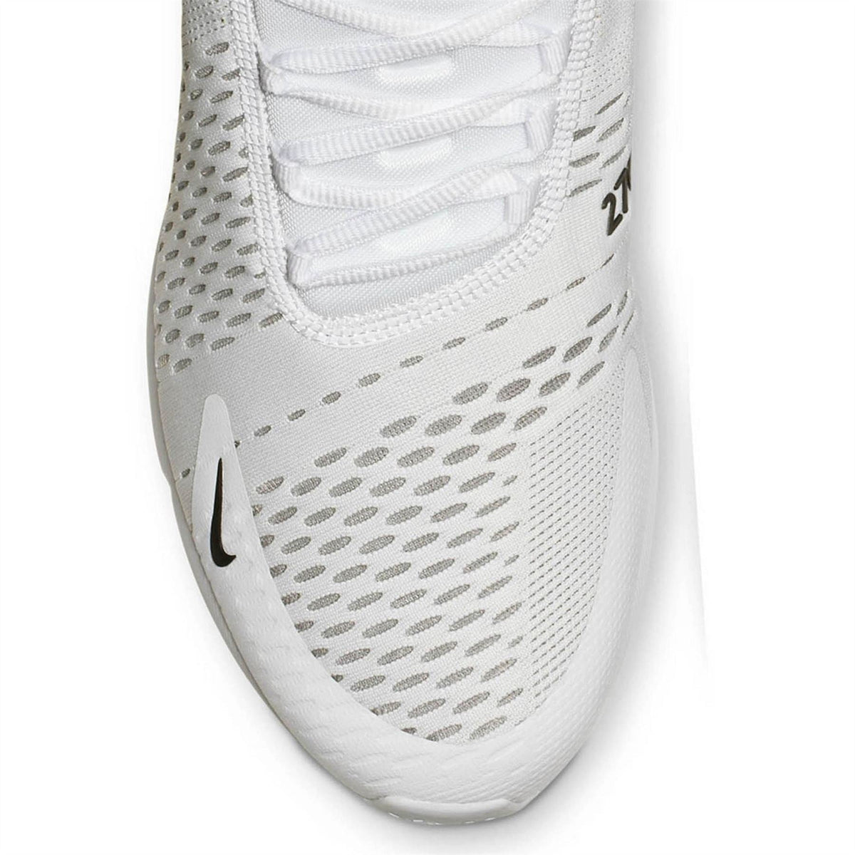 Air Max 270 trainer side close-up in white with textured mesh and black swoosh