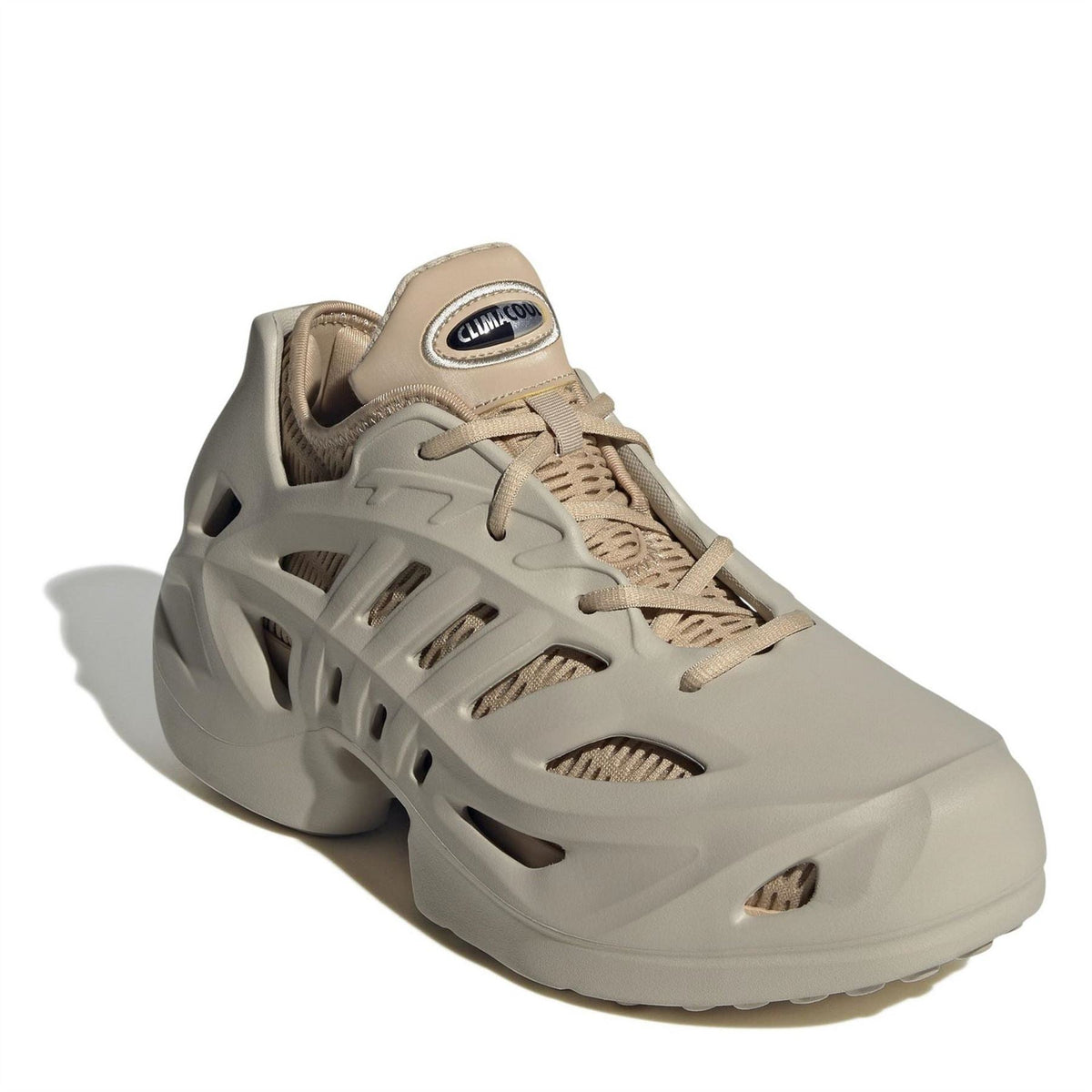 Beige adidas Adifom low-top sneakers, lace-up upper with textured ventilated panels
