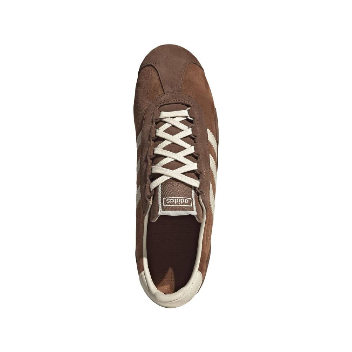 Brown suede trainers front view with white lace-up and adidas logo tongue patch.