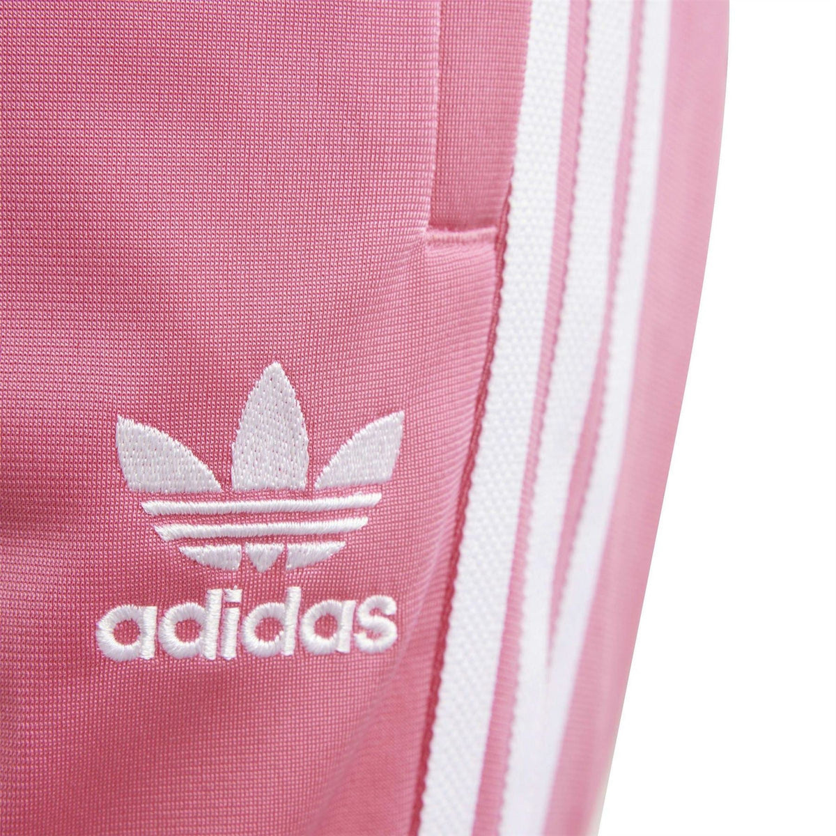 adidas logo and white triple stripes on pink track pants