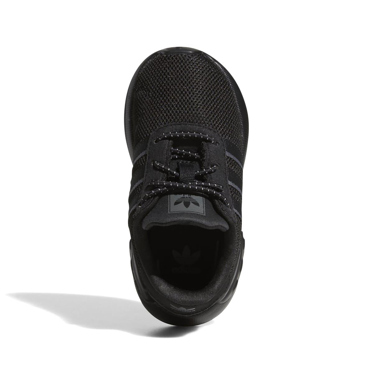 Infant lace-up trainers with black mesh upper and padded tongue, front view.