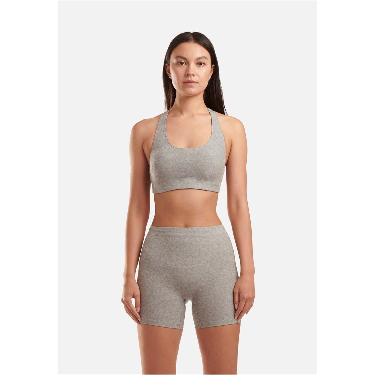 Women's heather grey racer back crop top with wide scoop neck and racerback straps.