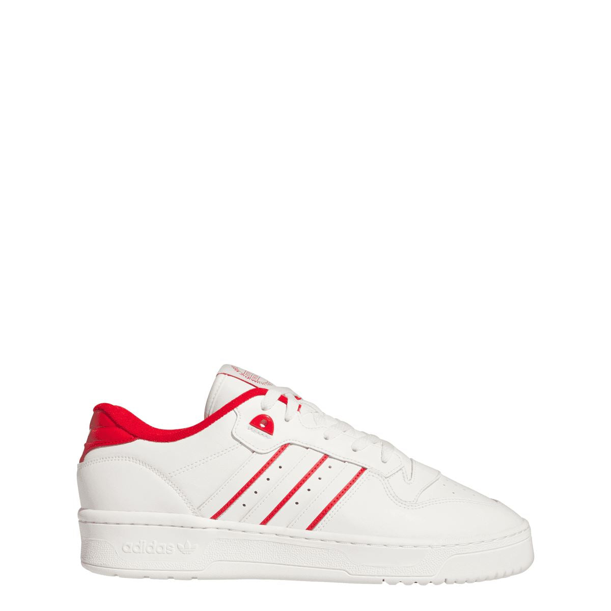 White low-top lace-up sneakers with red collar lining and three side stripes.