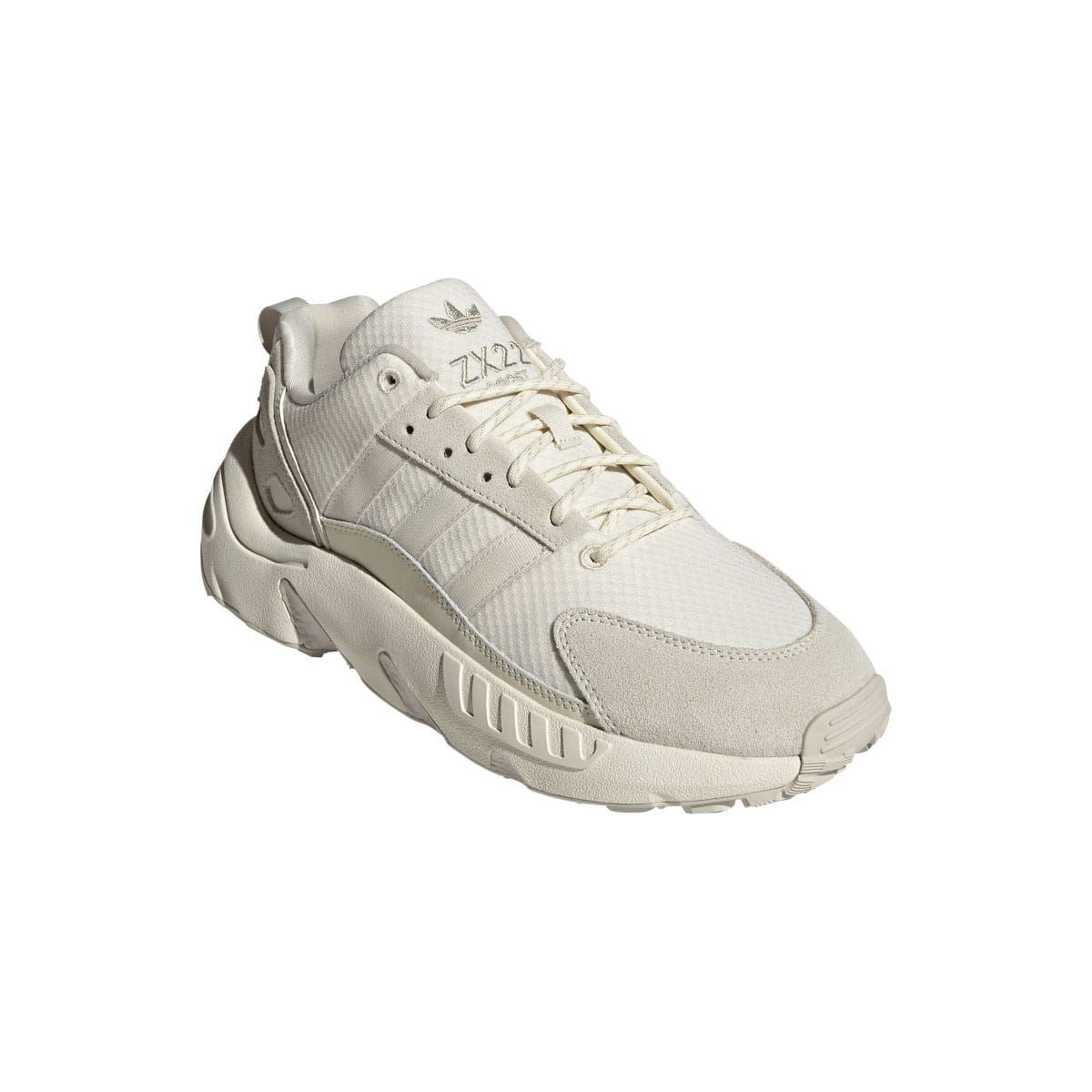 Cream adidas ZX 22 Boost trainers, 3/4 angle view with lace-up vamp and midsole