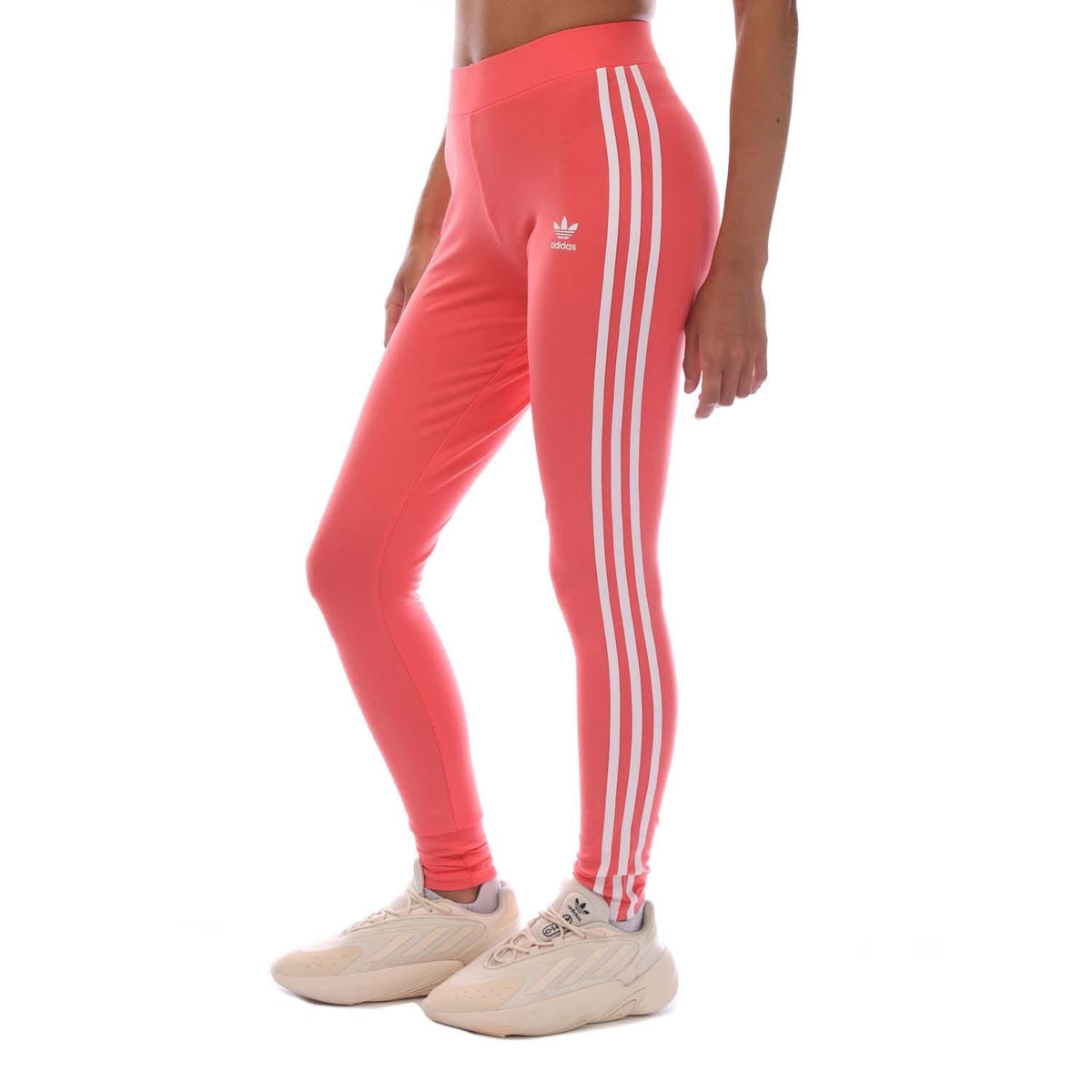 Pink leggings with adidas trefoil and vertical white 3-stripe side panel