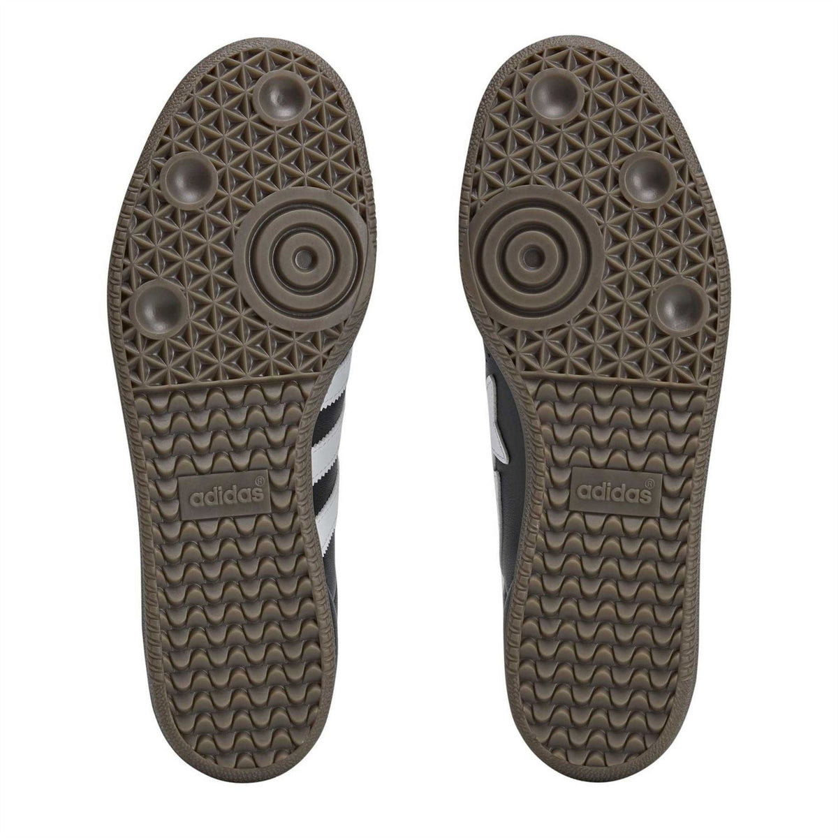 Sandal outsoles showing textured tread patterns and adidas branding