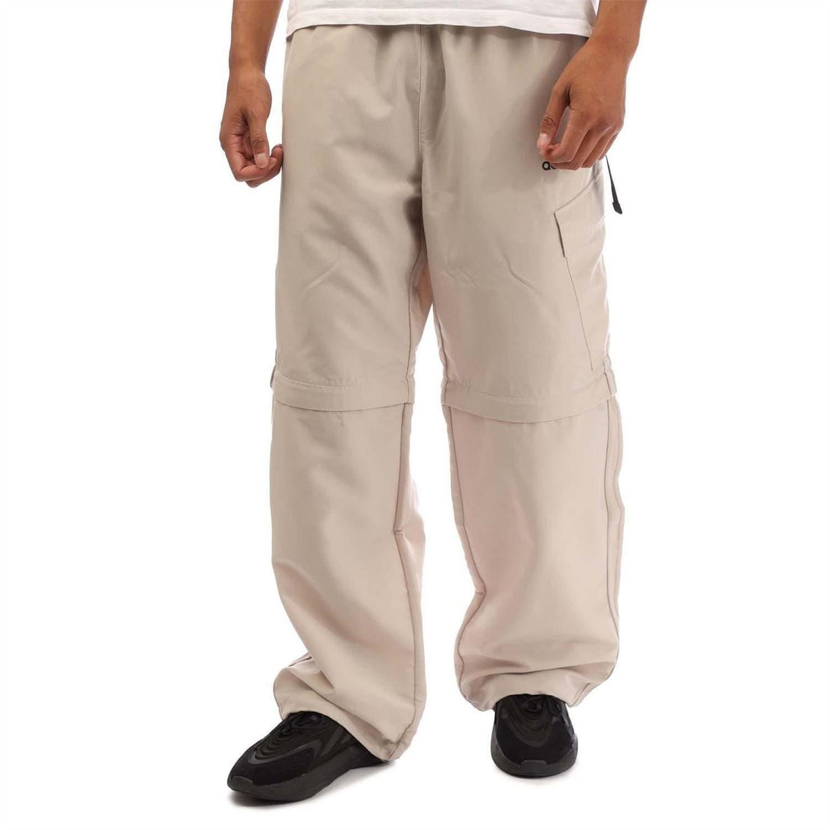 Beige cargo jogger pants with flap pockets and elastic cuffs