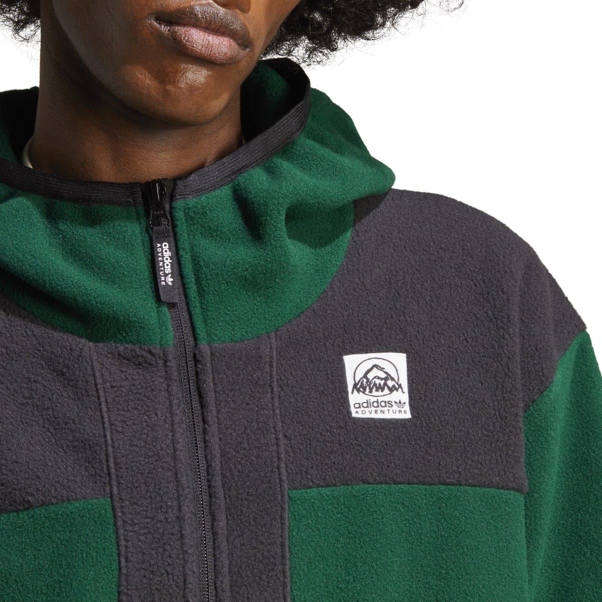 adidas polar fleece hoodie close-up of front logo patch and center zip